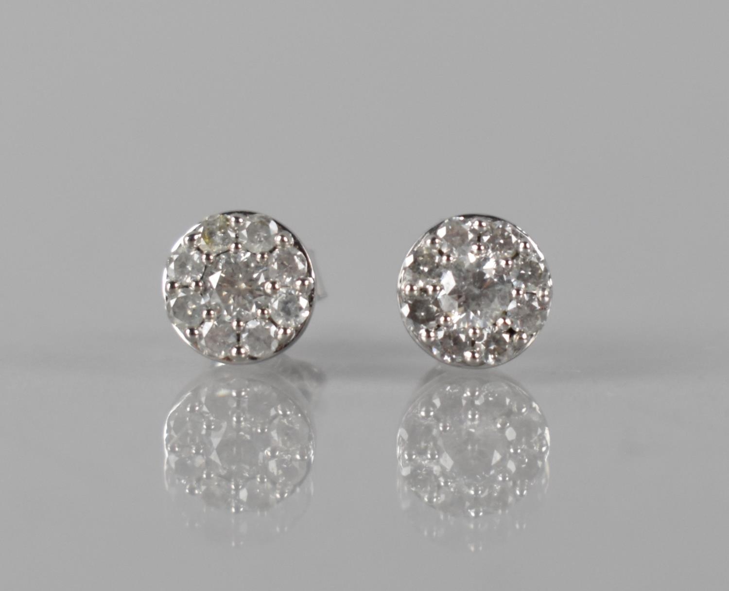 A Pair of 9ct White Gold and Diamond Cluster Earrings, Central Round Brilliant Cut Diamonds Approx