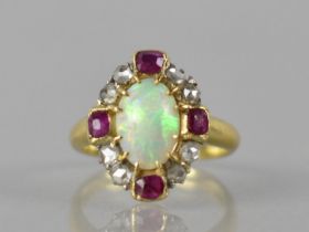 An Opal, Ruby and Diamond Mixed Metal Dress Ring, Central Oval Opal Cabochon Measuring 10.5 by 7mm