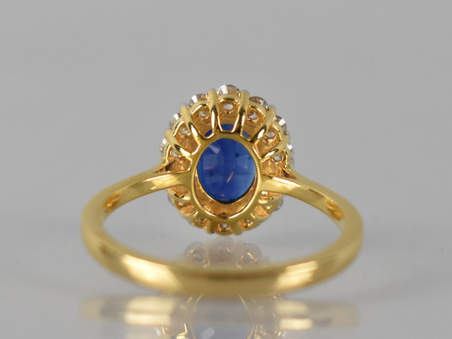 An 18ct Gold, Kyanite and Diamond Cluster Ring, Central Raised Claw Set Oval Cut Stone Measuring 1. - Image 3 of 3
