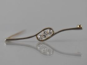 A Diamond Trilogy Brooch, Central Bezel Set Diamond Measuring 4mm Diameter Approx in White Metal