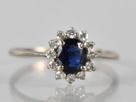 A 14ct White Gold, Sapphire and Diamond Ring, Oval Cut Sapphire Measuring 5mm by 4mm Mounted in Four