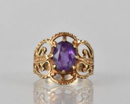 A 9ct Gold and Amethyst Dress Ring, Oval Cut Amethyst Measuring 8.5mm by 7mm Approx, Set in Eight