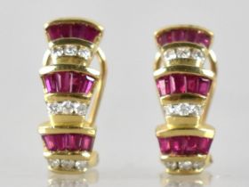 A Pair of Diamond and Ruby 14ct Gold Mounted Earrings, Three Tiered Odeonesque Design, Each Tier