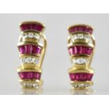 A Pair of Diamond and Ruby 14ct Gold Mounted Earrings, Three Tiered Odeonesque Design, Each Tier