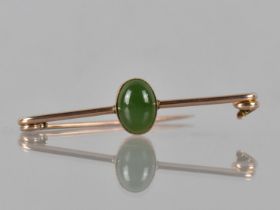 A Victorian 9ct Rose Gold Bar Brooch with Central Green Nephrite Cabochon Oval, 14mm by 10mm in