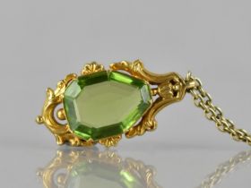 A 19th Century Gold Metal Mounted Freeform, Step Cut Peridot Pendant, Stone Measuring 16mm by 12mm