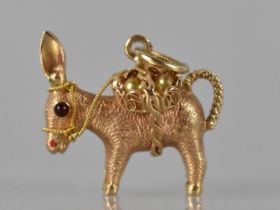 A French 18ct Gold Pendant in the Form of a Laden Donkey, Baskets Containing Two Simulated Pearls,