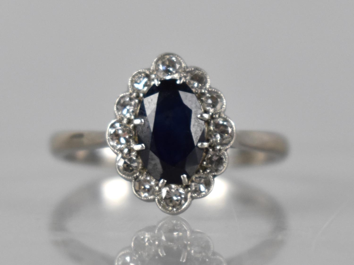 A Sapphire, Diamond and 18ct White Gold Ring, Large Oval Cut Sapphire Measuring 8mm by 5.5mm in