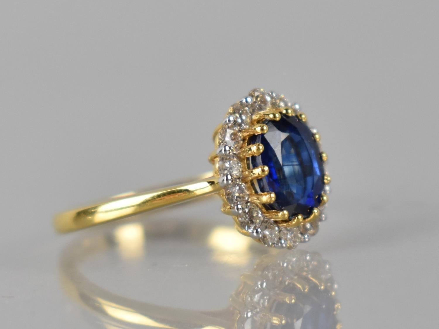 An 18ct Gold, Kyanite and Diamond Cluster Ring, Central Raised Claw Set Oval Cut Stone Measuring 1. - Image 2 of 3