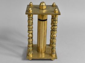 An Early 20th Century Brass Coin Store of Cylindrical Form and Set in Rectangular Stand, 22cms High