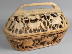 An African Carved Wooden Bowl and Cover with Pierced Decoration Incorporating African Animals etc,