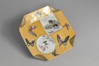 A Japanese Square Dish with Canted Edges Decorated with Cartouches and Butterflies on Orange Ground,