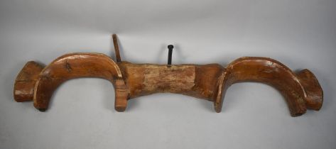 A Carved Wooden Double Ox Yoke, 130cms Long