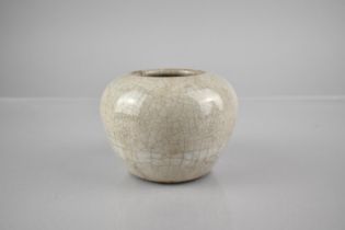 A Chinese White Crackle Glazed Pot of Squat Globular Form, 7.5cms High