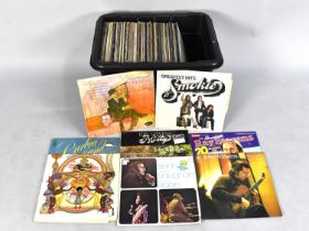 A Collection of Various 33RPM Records to include Abba, The Chieftains, Jo Cocker, Nat King Cole,