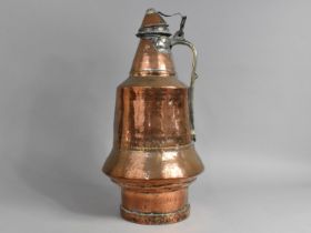 A North African Arabic Copper Water Jug with Brass Handle and Lid, 48cms High