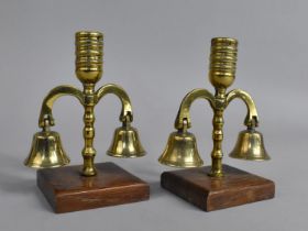 A Pair of Brass Candlesticks formed From Horse Brass Bells and Plume Holders, 13.5cms High