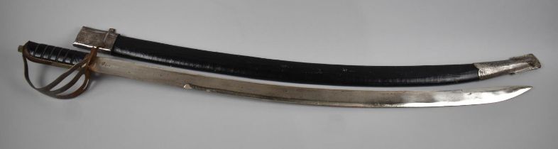 A Mid 20th Century Indian Sikh Sword with Curved Blade Inscribed Made In India and Leather Scabbard