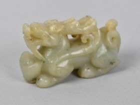 A Carved Faux Jade Dragon, 8cms Long