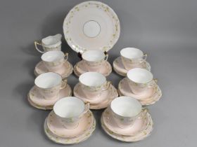 A Old Royal China Pink Glazed Tea Set Decorated with Floral Enamel Trim and Gilt Highlights to