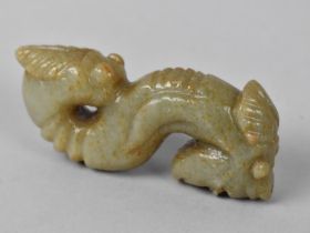 A Carved Oriental Faux Jade Double Ended Serpent with Cicada and Mask Ends, 9cms Long