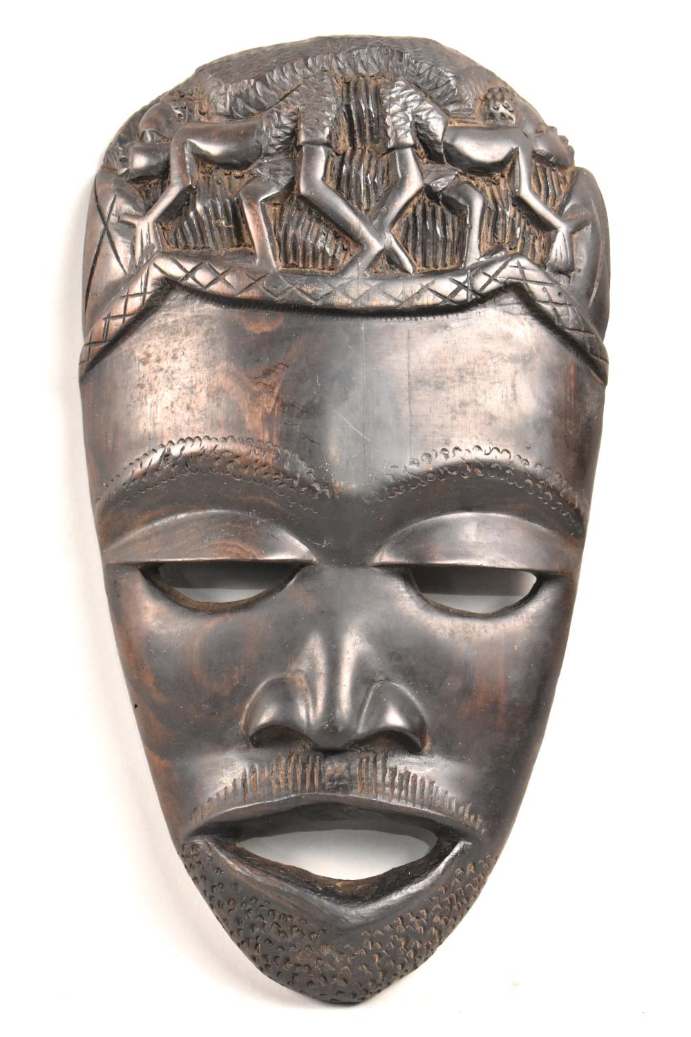 A Carved African Souvenir Tribal Mask, 28cms High