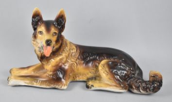 A Mid 20th Century Large Painted Plaster Study of Reclining German Shepherd, 53cms Wide
