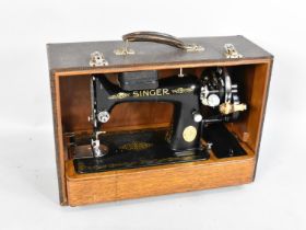 A Vintage Manual Singer Sewing Machine in Carrying Case No EC580905