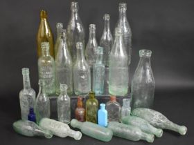 A Collection of Various Vintage Glass Bottles to Include Beer Bottles etc