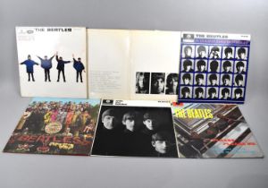 A Collection of Six Beatles LPs to include The White Album No 0221714, Beatles Please Please Me LP