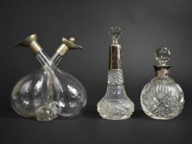 A Glass and Silver Mounted Double Cruet Bottle (Missing One Stopper) Together with Two Silver