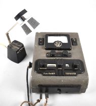A Vintage AVC Electronic Test Meter together with a Modern Adjustable Work Lamp
