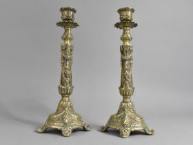 A Pair of Cast Brass Candlesticks with Scrolled Feet, 27cms High