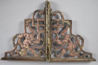 A Pair of Copper and Brass Shelf Brackets Decorated in Relief with Cherubs, 24cms High