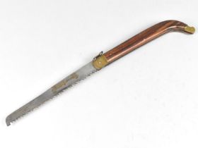 A Vintage Locking Pruning Saw with Rosewood Handle, Brass Mounts and Blade Stamped "Whitby"