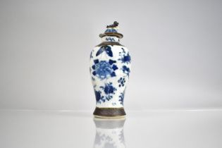 A Chinese Porcelain Blue and White Nanking Crackle Glazed Baluster Vase and Cover, decorated with