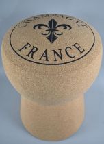 A Novelty Stool in the Form of a Champagne Cork, 34cms Diameter and 48cms High