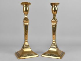 A Pair of Georgian Brass Candlesticks, With Pushers, Onne with Damaged Top, 25cms High