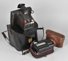 A Vintage Polaroid Land Camera, The Super Swinger, Together with Kodak Penny Disk Camera and Leather