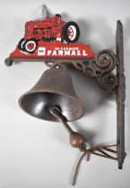 A Cold Painted Cast Iron Wall Hanging Door Bell in the Form of a Farmall Tractor, 37cms High