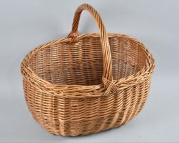 A Mid 20th Century Wicker Oval Shopping Basket