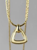 A Christian Dior Necklace, Gilt and White Enamel Triangular Pendant on Chain with Hanging Tag for