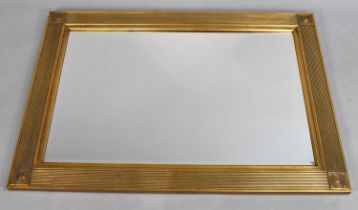 A Modern Gilt Framed Rectangular Wall Mirror, 109x79cms