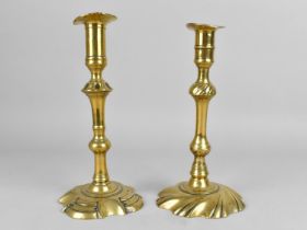 A Pair of Georgian Brass Candlesticks with Pushers, Candleholders Somewhat Distorted, 23cms High