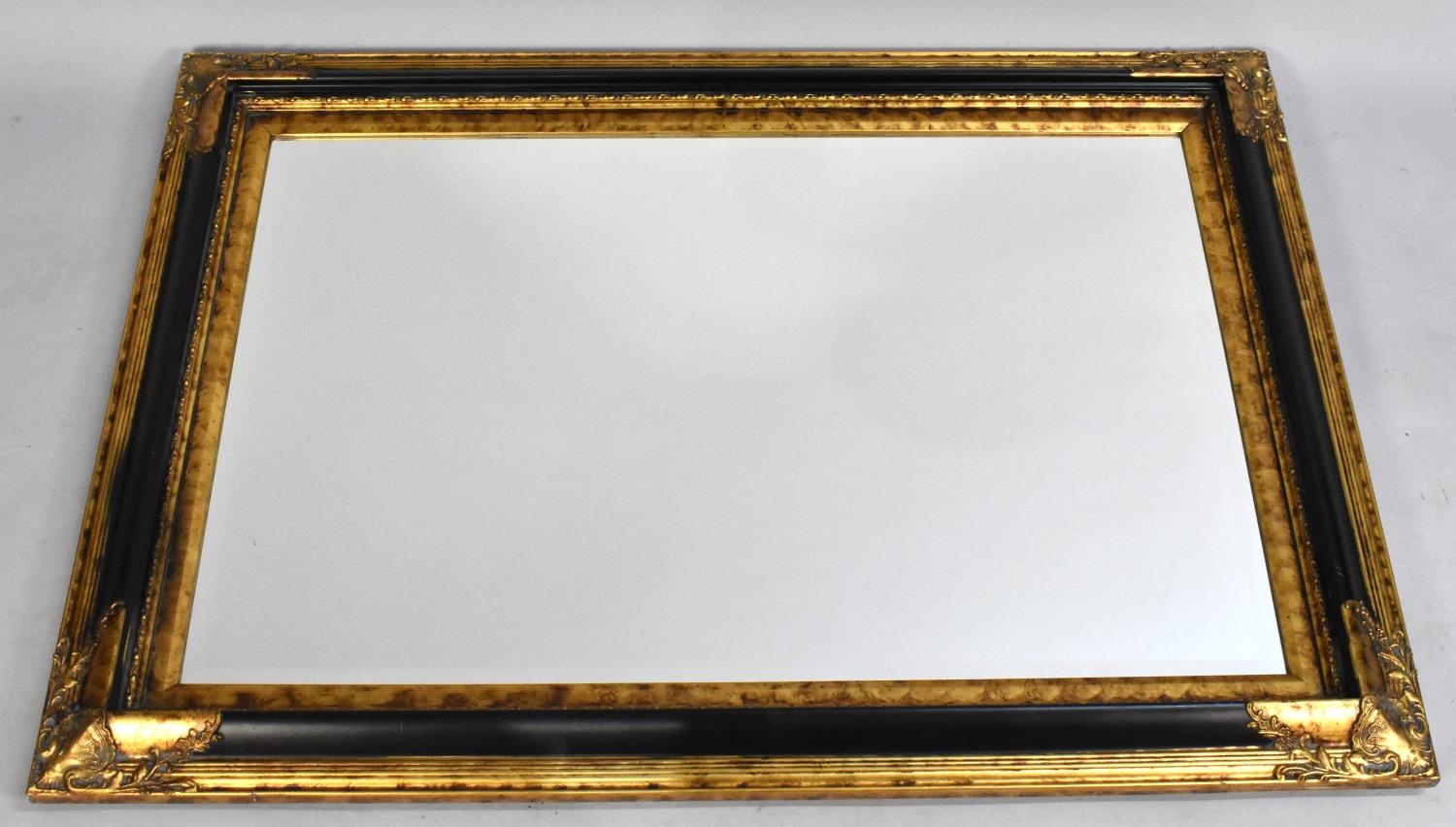 A Modern Gilt Framed Rectangular Wall Mirror, 110x80cms
