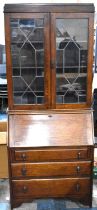 An Edwardian Oak Fall Front Bureau Bookcase with Three Drawers to Base and Leaded Glazed and Shelved