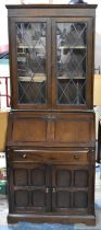 A Mid 20th Century Oak Bureau Bookcase with Fall Front to Fitted Interior and Lead Glazed Shelved