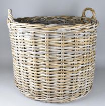 A Large Wicker Log Basket with Twin Handles, 67cm diameter and 51cm high