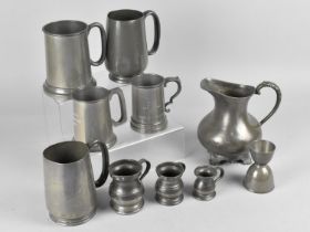 A Collection of Pewter Tankards, Jug etc