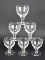 A Set of Six Star Cut Glasses on Heavy Stems and Circular Plain Foot